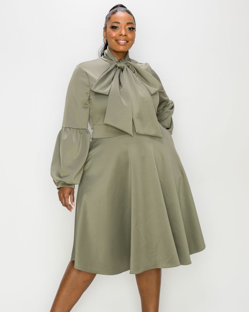 Front of a model wearing a size 1X Bekah Flare Dress in Dark Sage by L I V D. | dia_product_style_image_id:241222